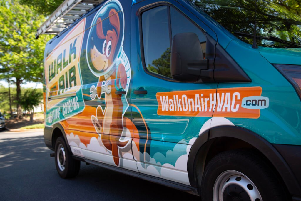 a side of the walk on air hvac truck with the logo and dog mascot